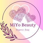 MiYo company logo hearts in a circle with a leaf motif on a gradient yellow to pink background