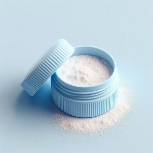 Pale blue container with open lid showing white powder on a pale blue background